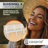 A smiling woman wearing a straw hat, with a white garden bench superimposed in a circular frame. Náhled obrázku produktu