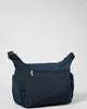 A dark blue Kipling crossbody bag is shown from the back against a white background. Produktbild-Vorschau