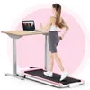 A woman is running on a pink treadmill while working on a laptop at a standing desk. Produktbild-Vorschau