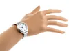 A woman's hand wearing a silver watch. Podgląd zdjęcia produktu