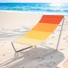 A colorful beach chair on a sandy beach with the ocean in the background. Náhled obrázku produktu