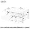 A technical drawing of a coffee table with dimensions indicated. Voir les images du produit