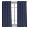 Two navy blue curtains hanging in front of a window. Produktbild-Vorschau