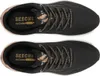 A top-down view of two black Skechers women's sports shoes with rose gold accents. Náhled obrázku produktu