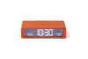An orange digital alarm clock shown from the front on a white background. Náhled obrázku produktu