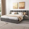 A modern bedroom with a large upholstered bed. Produktbild-Vorschau