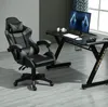 A gaming chair and desk setup in a room. Produktbild-Vorschau
