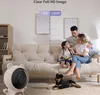 A family and their dog are relaxing in a living room, with a baby monitor in the foreground. Produktbild-Vorschau