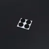 Four black circular felt pads on a white backing square, placed on a black surface. Náhled obrázku produktu