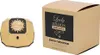 A gold-colored perfume bottle and its beige packaging are displayed side-by-side on a white background. Anteprima dell’immagine prodotto