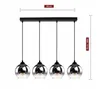 A four-bulb pendant light fixture with glass shades, shown against a white background with measurement indicators. Produktbild-Vorschau