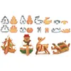 A collection of Christmas-themed cookie cutters and decorated gingerbread cookies. Náhľad obrázku produktu