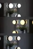 Three different lighting conditions of a Hollywood mirror with LED lights. Anteprima dell’immagine prodotto