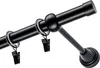 A close-up view of a black curtain rod with rings and clips. Podgląd zdjęcia produktu