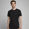 A young man wearing a black t-shirt against a plain background. Produktbild-Vorschau