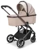 A studio shot of a beige and brown baby stroller against a white background. Produktbild-Vorschau