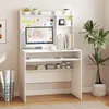 A white computer desk with a monitor, keyboard, and shelves, set against a light gray wall. Anteprima dell’immagine prodotto