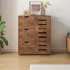 A wooden cabinet with drawers and shelves, decorated with a vintage radio, a framed picture, and a vase of flowers. Náhľad obrázku produktu