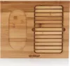 A top-down view of a bamboo cutting board with a carved out section for a stone and a slatted section for bread. Produktbild-Vorschau