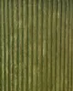 A close-up, full-frame shot of a green, ribbed planter. Podgląd zdjęcia produktu