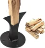 A manual log splitter with a piece of wood inserted, and a pile of split logs next to it, on a white background. Produktbild-Vorschau