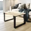 A modern living room scene with a couch and coffee table. Produktbild-Vorschau