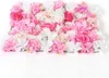A close-up of a wall decoration made of artificial flowers. Produktbild-Vorschau