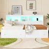 A white bed with storage drawers and a headboard with LED lighting and shelves. Voir les images du produit