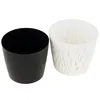 Two plant pots, one black and one white, are shown against a white background. Podgląd zdjęcia produktu