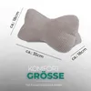 A taupe-colored bone-shaped pillow with dimensions indicated by text overlays. Produktbild-Vorschau