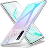 Two clear phone cases are shown crossed over each other, with one case partially covering a smartphone. Produktbild-Vorschau