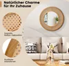 A round rattan mirror with a wooden frame is displayed on a wall above a sofa, with close-up details of the rattan and wood. Podgląd zdjęcia produktu