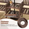 Close-up of a wooden garden bench with a built-in table and umbrella hole, showing a drink and coffee cup on the table. Produktbild-Vorschau