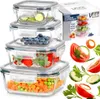 A stack of glass food storage containers filled with various foods, next to a product box and some fresh produce. Produktbild-Vorschau
