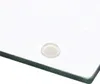 A close-up of a glass cutting board with a clear bumper on the corner. Náhled obrázku produktu