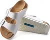 A pair of white Birkenstock sandals shown on a white background. Náhľad obrázku produktu