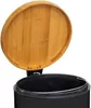 A close-up view of an open black trash can with a bamboo lid. Náhľad obrázku produktu