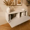 A wall-mounted TV lowboard with books and decorative items in a living room setting. Náhľad obrázku produktu