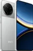 A silver Xiaomi Poco F7 Pro smartphone is shown from a diagonal angle, with its screen displaying a colorful abstract wallpaper. The phone is positioned in the foreground, with its back and front visible. Náhľad obrázku produktu