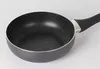 A close-up view of a black frying pan with a speckled interior and a black handle, set against a white background. Voir les images du produit