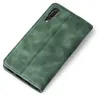 A green flip case for a smartphone, shown from a diagonal angle on a white background. Produktbild-Vorschau