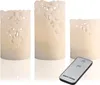 Three LED candles with intricate cut-out patterns and a remote control are displayed on a white background. Produktbild-Vorschau