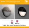 A split image showing a solar LED outdoor wall light, with one side showing the light off and the other side showing it illuminated. Below the lights are icons and text indicating charging and battery life. Náhled obrázku produktu