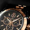 A close-up shot of a luxury analog watch with a black dial and gold accents. Anteprima dell’immagine prodotto