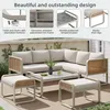 An outdoor patio set with a sectional sofa, coffee table, and ottomans. Voir les images du produit