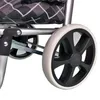 A close-up view of the wheels and frame of a shopping trolley. Produktbild-Vorschau