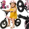 A collage of images featuring a young girl on a pink balance bike, along with illustrations and close-ups of the bike's components. Produktbild-Vorschau