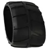A black rubber wheel cover with a tread pattern, shown against a white background. Produktbild-Vorschau