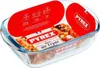 A Pyrex glass baking dish with a food item inside, presented with marketing labels and packaging. Náhľad obrázku produktu