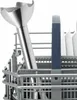 A close-up view of a hand blender attachment in a dishwasher basket. Produktbild-Vorschau
